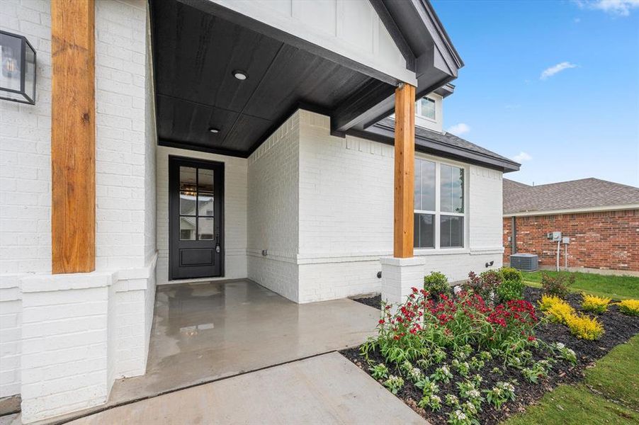 Front porch and beautifully landscaped