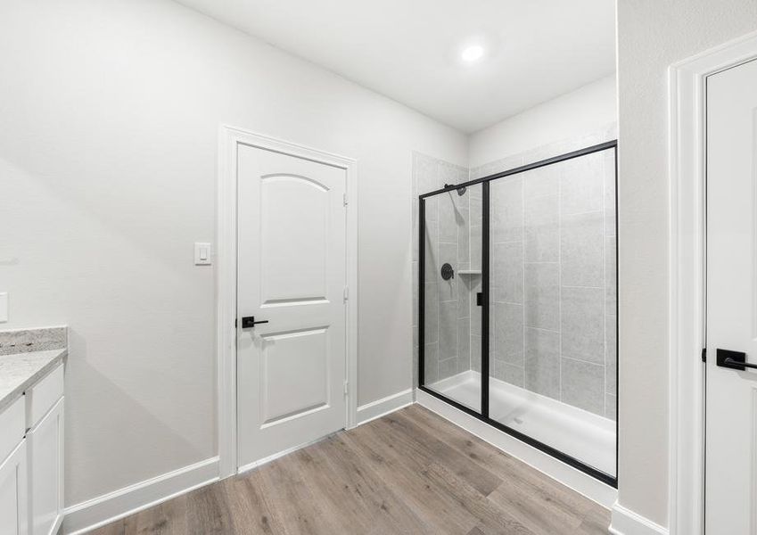 The master bathroom of the Blanco has a glass, walk-in shower.