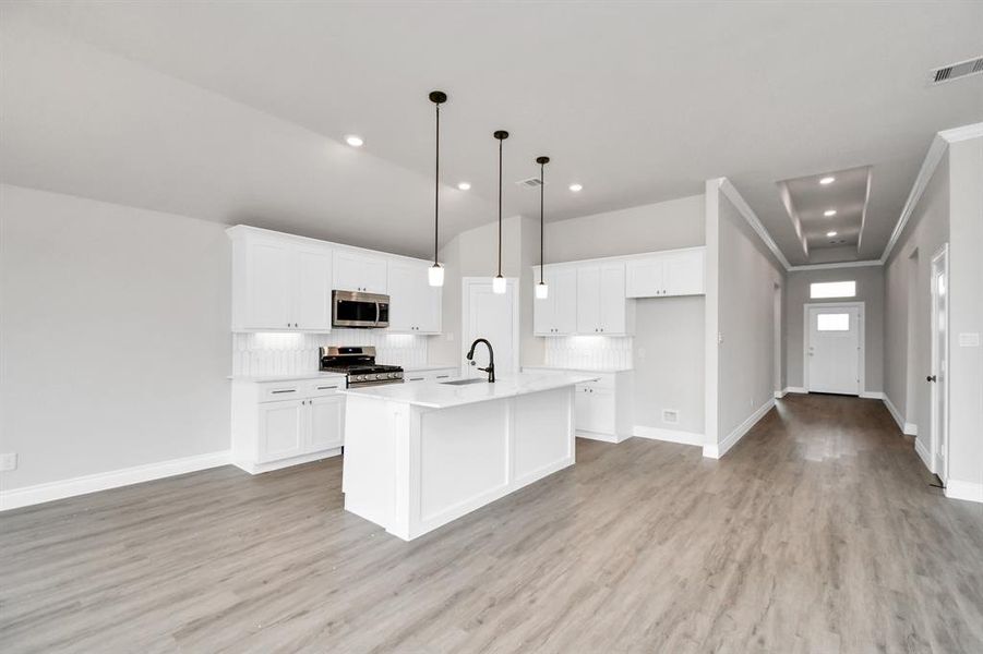 Open concept kitchen with kitchen island