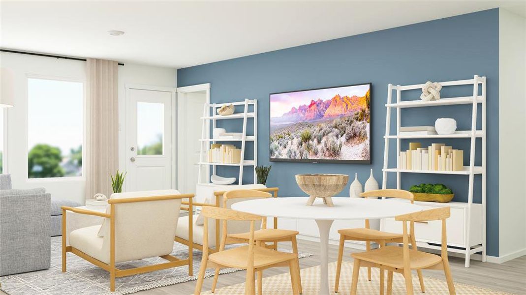 Dining area with light hardwood / wood-style flooring