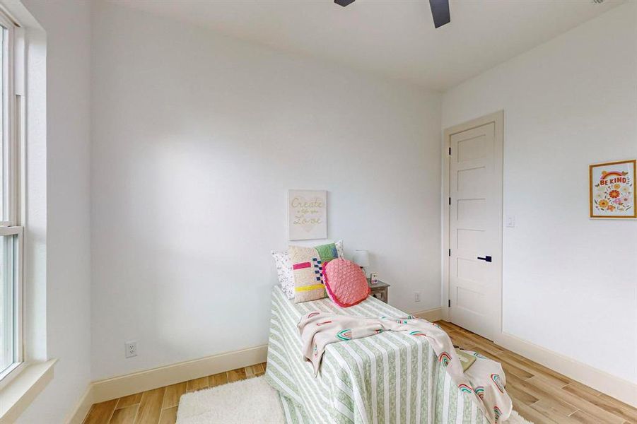 Sitting room with light hardwood / wood-style flooring and ceiling fan