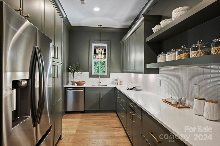 Scullery with secondary fridge and dishwasher