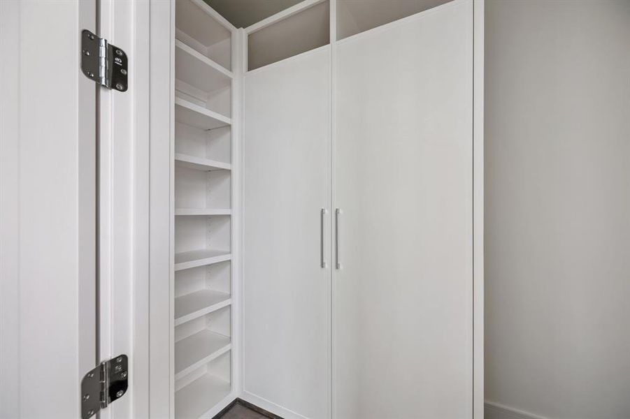 In the primary closets, furniture-style built-ins and dressers combine functionality with a touch of sophisticated design