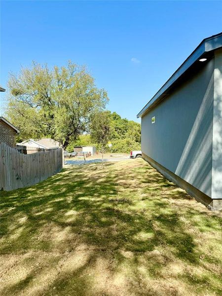 View of yard featuring a swimming pool