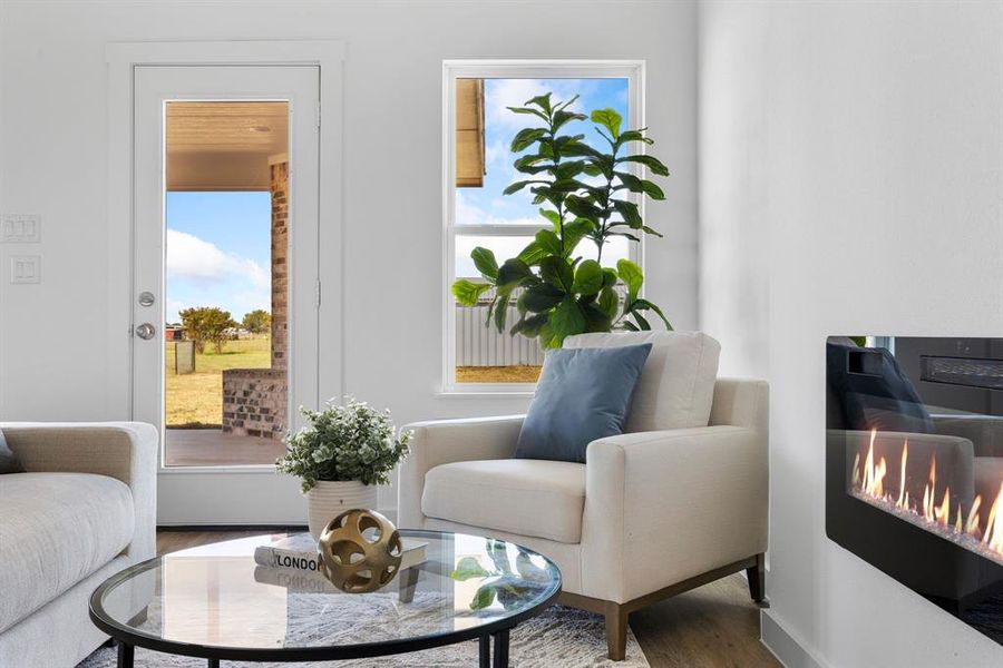 Living area featuring a wealth of natural light and hardwood / wood-style floors