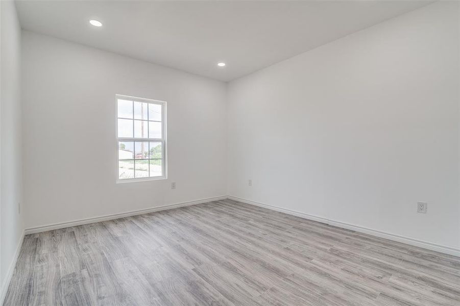 Empty room featuring light hardwood / wood-style floors