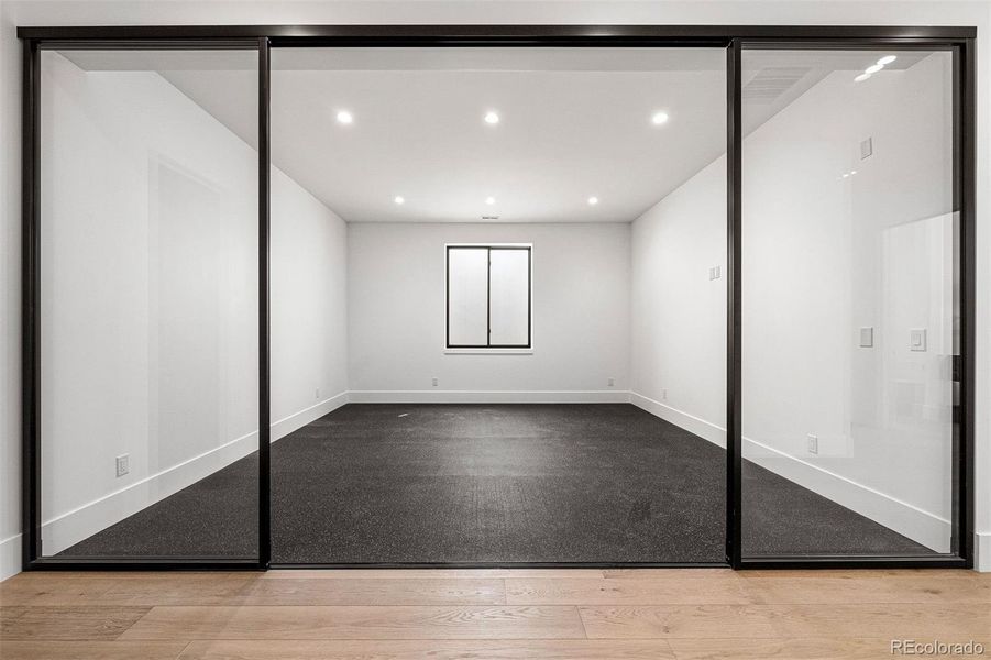 Exercise room with wall of glass doors