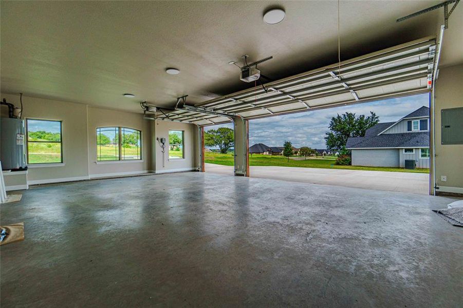 Garage with a garage door opener and water heater