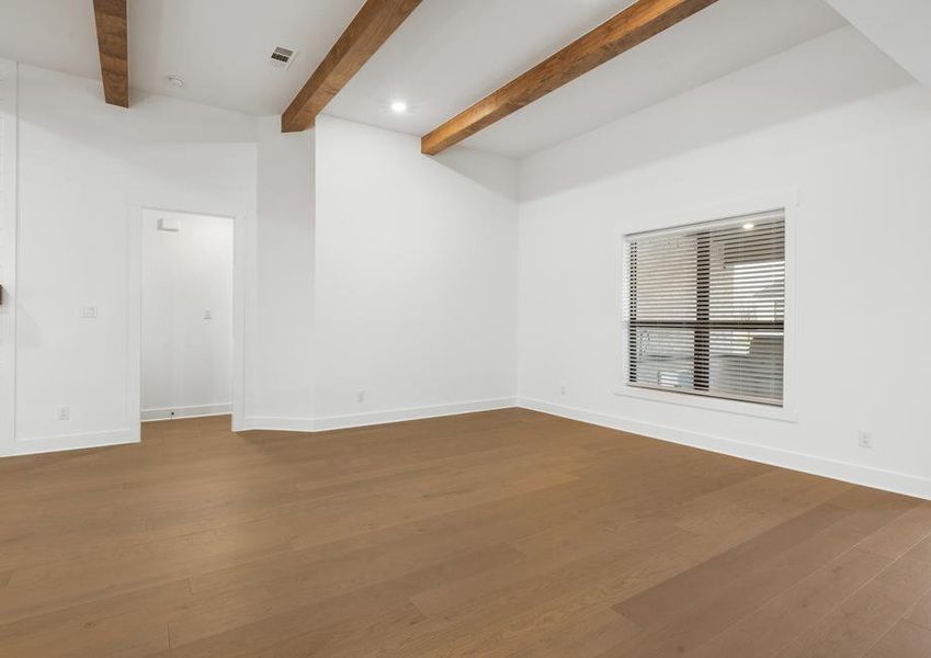 The spacious family room has a large window that lets in natural light.