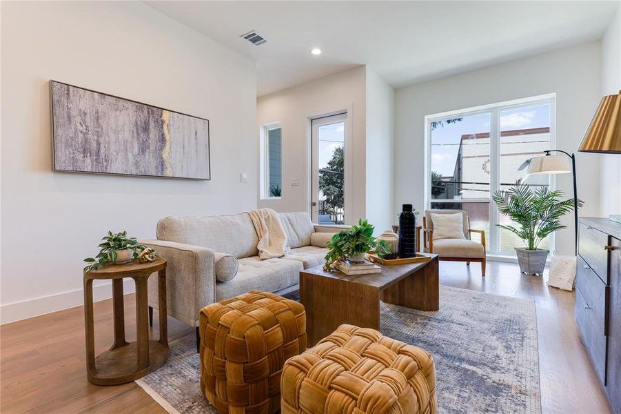 Living room with light wood-type flooring