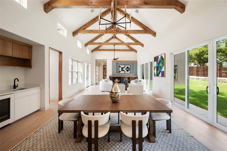 Dining area with sink, light hardwood / wood-style flooring, and a wealth of natural light