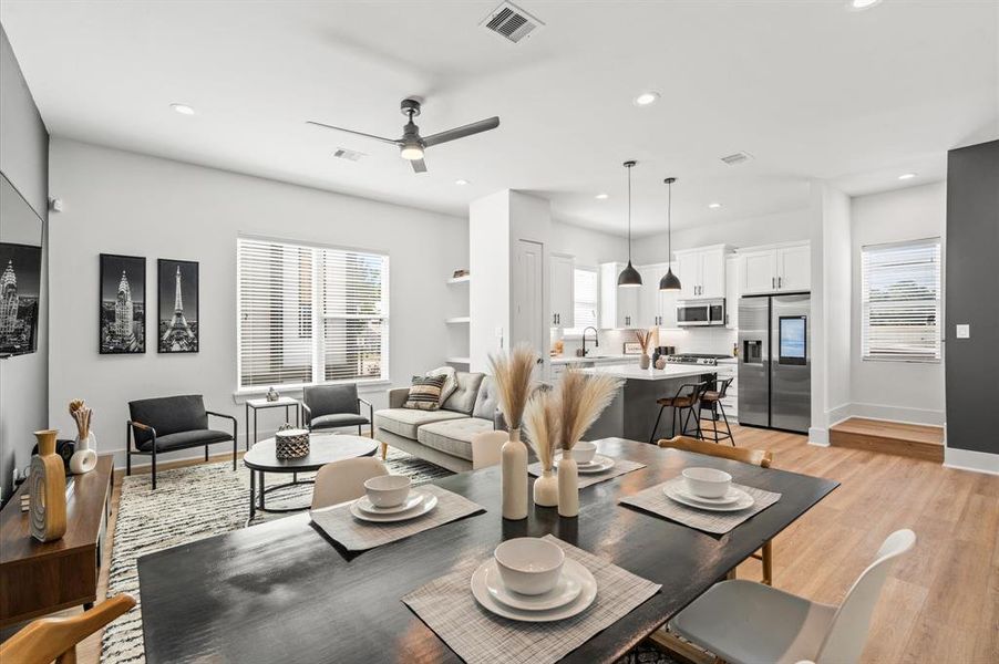 Enjoy a realm of comfort, where luxury vinyl flooring, elegant baseboards, contemporary lightning and cabinetry converge harmoniously. Bathed in natural light, this level exudes warmth and invites you to unwind within a modern space.*All interior photos are from the model home: 5216 Pine Tree.*