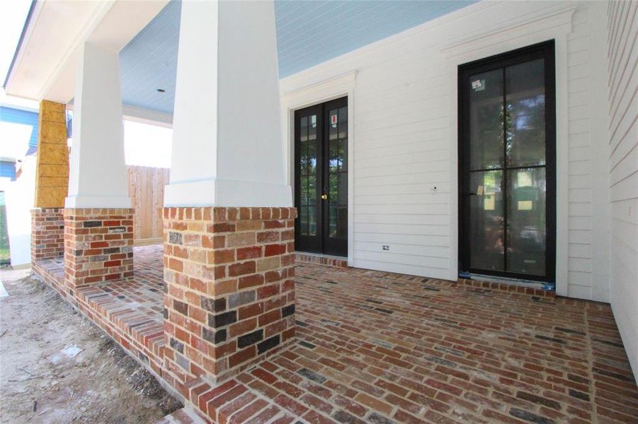 Home offers a deep brick front porch w/ swing, 2 sets of French doors leading to the Study & Steel/Glass Front Entry Door w/ gas lantern.