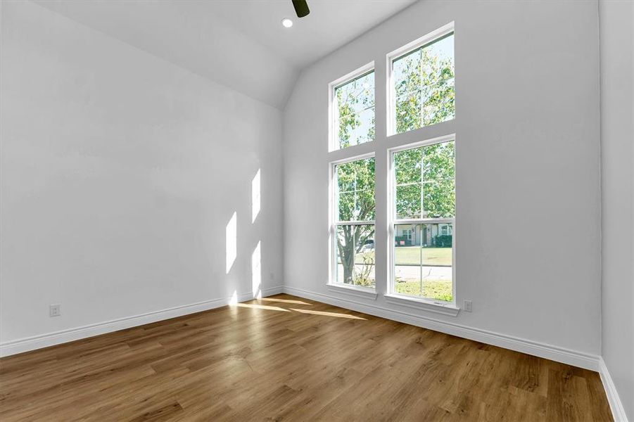 Second bedroom, also located at the front of the house, with high ceiling, 3 switch LED ceiling fan, walk-in closet and tons of natural light.