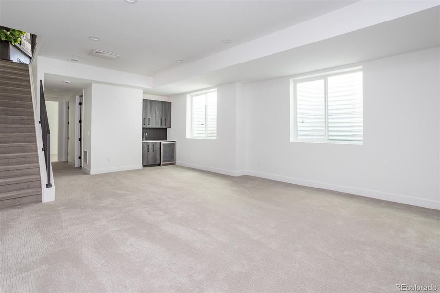 Basement rec room with soaring ceilings