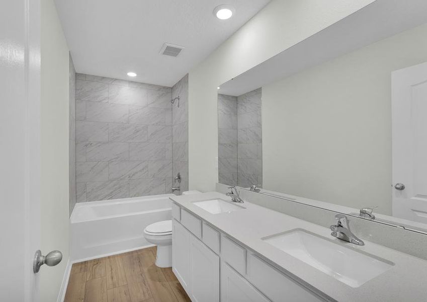 The secondary bathroom provides your guests the perfect place to get ready for their day