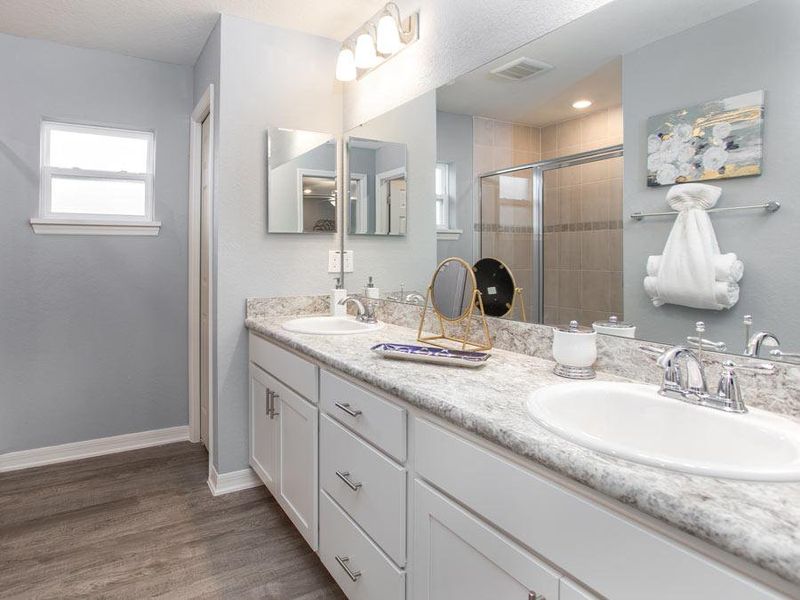 Your suite is complete with a spacious en-suite bath - Begonia home plan by Highland Homes