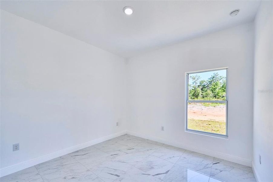 One of two secondary bedrooms