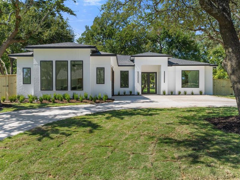 Contemporary home featuring a front lawn