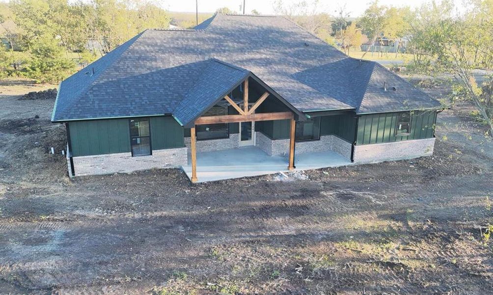 View of back of property with a patio