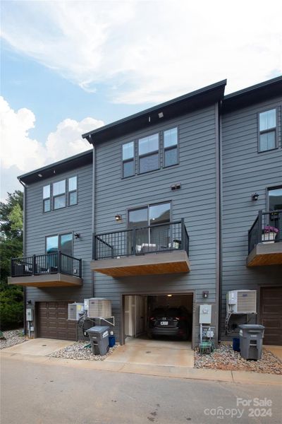 Rear access garage comfortably fits a mid-sized SUV, with storage room to spare.