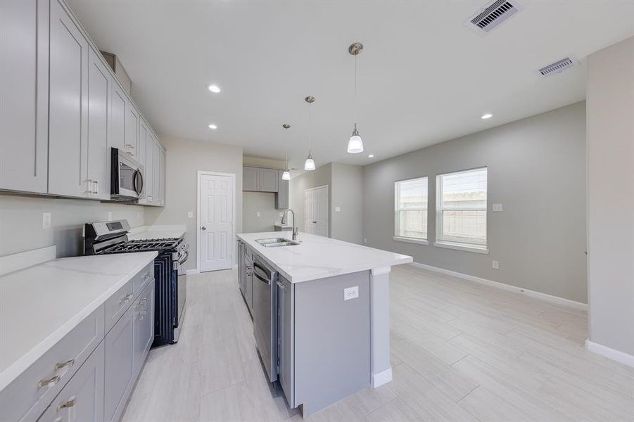 The kitchen boasts ample cabinetry, providing plenty of storage for all your cooking essentials and dining ware. With thoughtfully designed shelves and drawers, you can keep your kitchen organized and clutter-free, making meal preparation and entertaining a breeze.