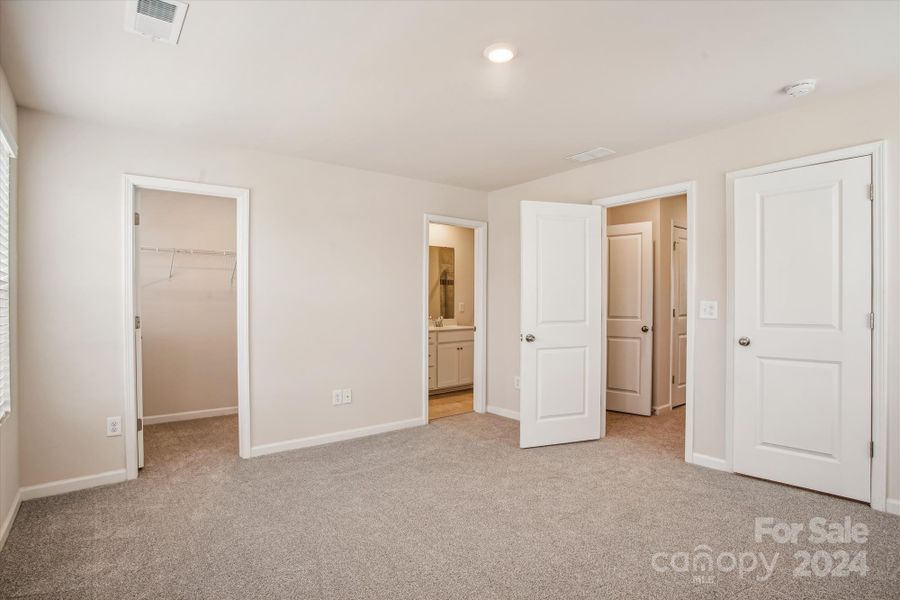 Primary bedroom with walk in closet