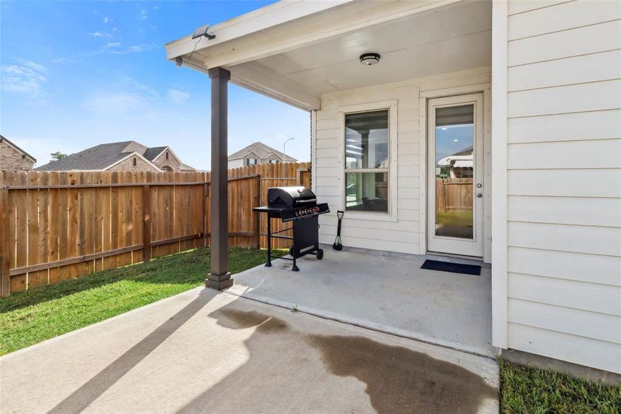 Step out from your kitchen to the charming covered patio, perfectly designed for alfresco dining and entertaining.