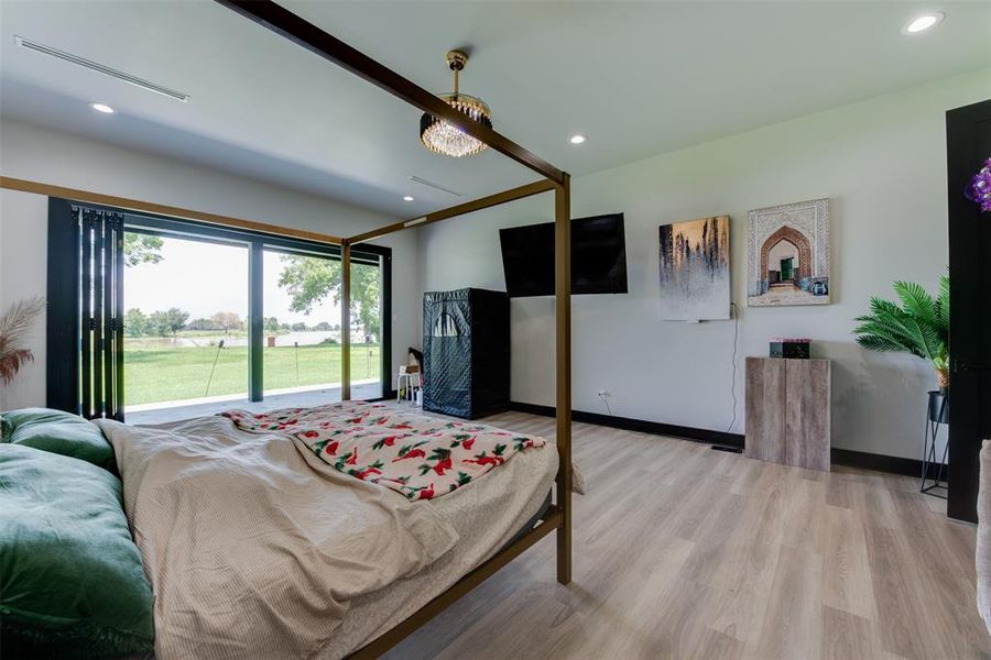 PRIMARY BEDROOM SLIDING DOORS WITH LAKE VIEW