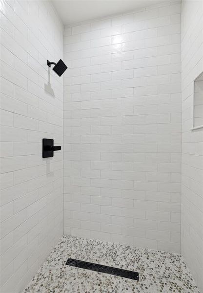 Bathroom featuring tiled shower