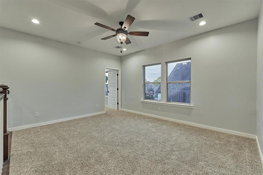 This room is just off of the second primary bedroom and can be an additional living space or game room.