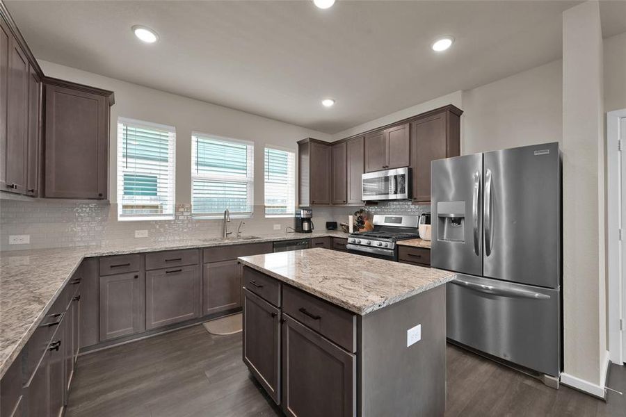 Your kitchen offers plenty of counter and cabinet space for food preparation and storage.  You'll enjoy the upgrade of the water filtration system, power outlets above the cabinets, and the new cabinet hardware in this space.