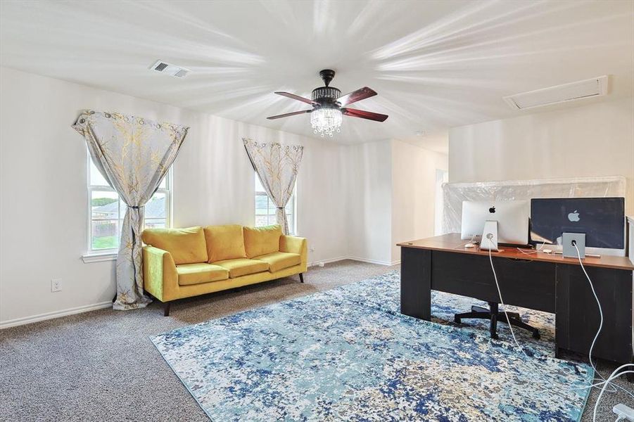 Home office featuring carpet and ceiling fan