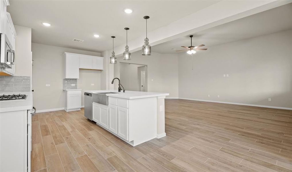 Kitchen overlooks great room (*Photo not of actual home and used for illustration purposes only.)