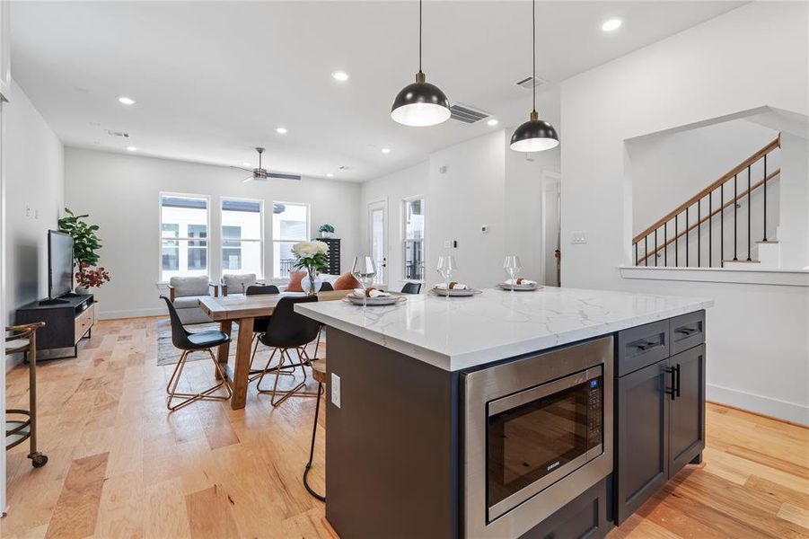 This stunning island kitchen comes standard with a built in stainless steel microwave with a beautiful accent to follow.