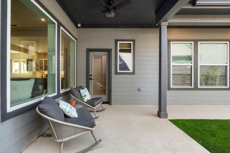 Back patio with ceiling fan.