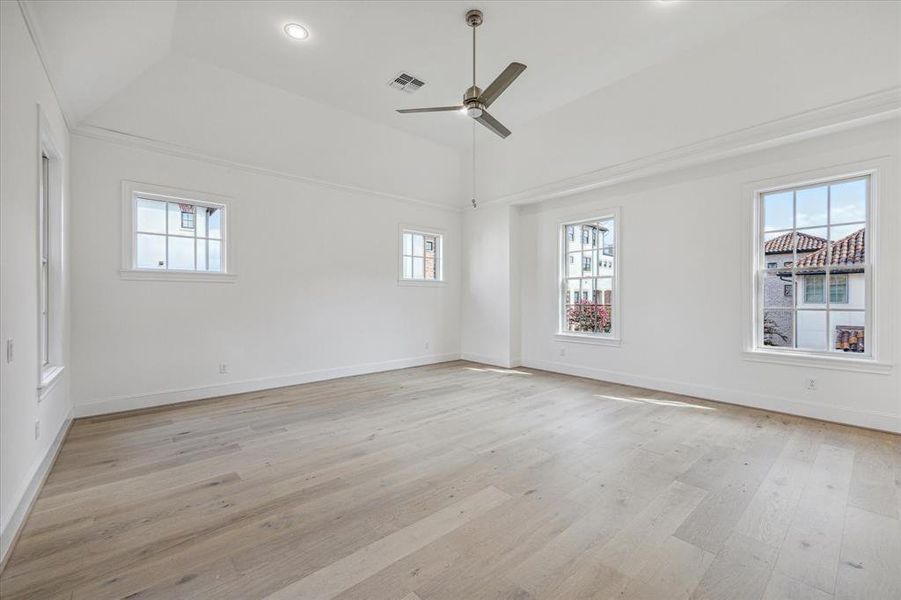 Spacious primary suite with vaulted ceiling