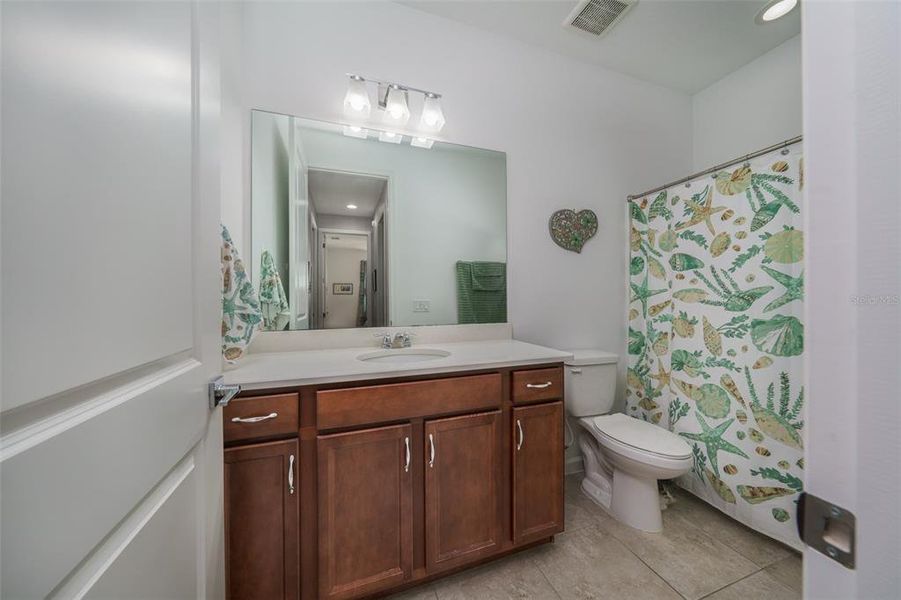 Guest bathroom with tub/shower combo.