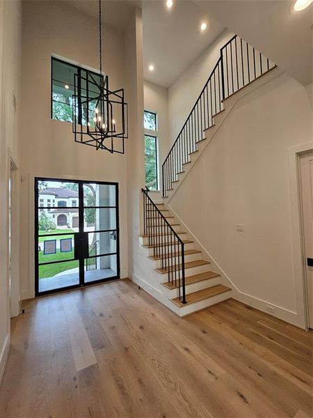 Main entrance foyer. Staircase with all metal railings and rods