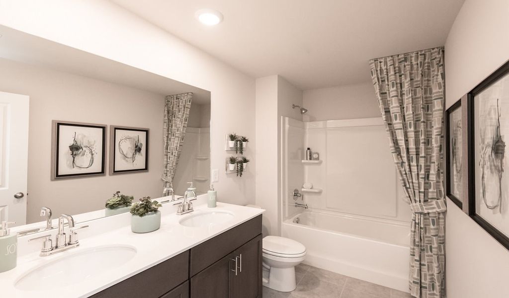 Dual sinks in the upstairs secondary bedroom will make mornings a breeze.