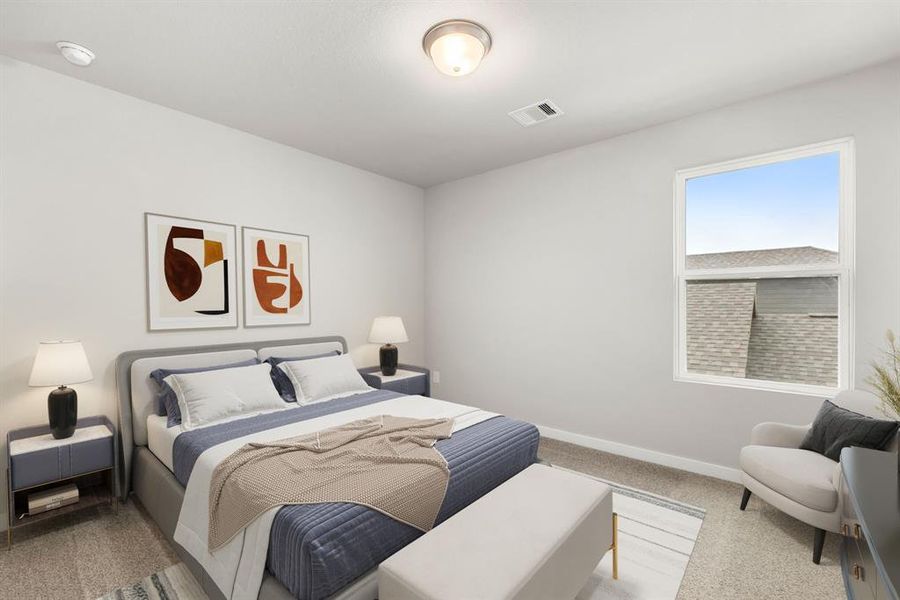 Secondary bedroom features plush carpet, neutral paint, large window and ample closet space.