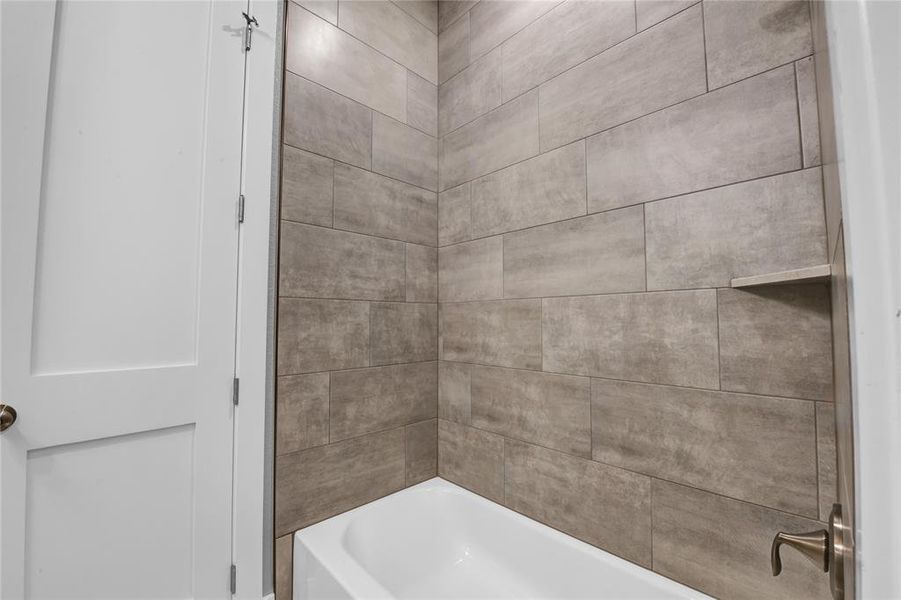 Bathroom featuring tile floors and vanity