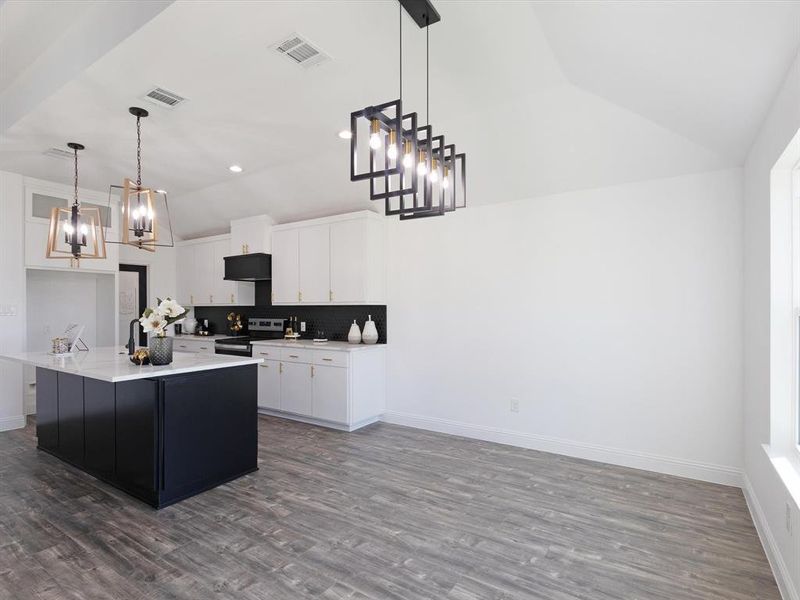 Kitchen with lofted ceiling, electric range, dark hardwood / wood-style flooring, white cabinetry, and decorative light fixtures