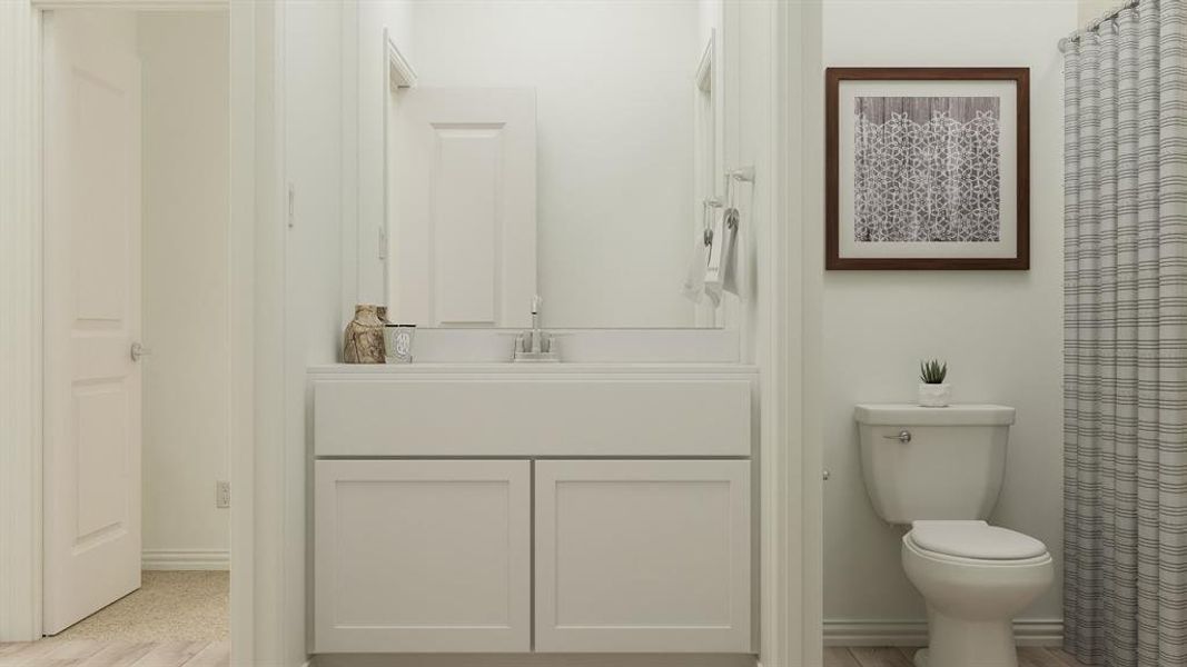 Bathroom with toilet, hardwood / wood-style flooring, and vanity