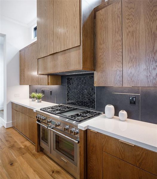 Custom built Italian style solid white Oak cabinets with a honey brown stain, Euro hinges concealed with full extension drawer slides