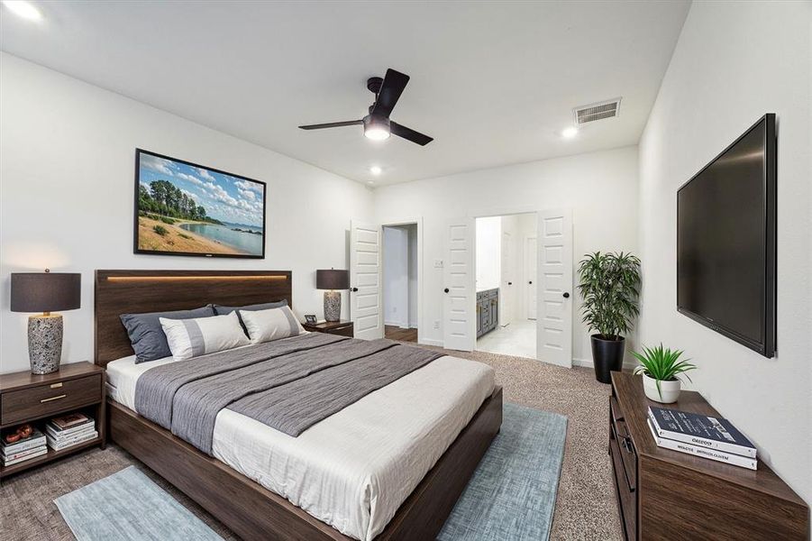 Step into your private sanctuary in this primary bedroom, featuring a direct connection to the en-suite bath. The room's open and airy design invites relaxation, with soft carpeting underfoot and a soothing color palette throughout.