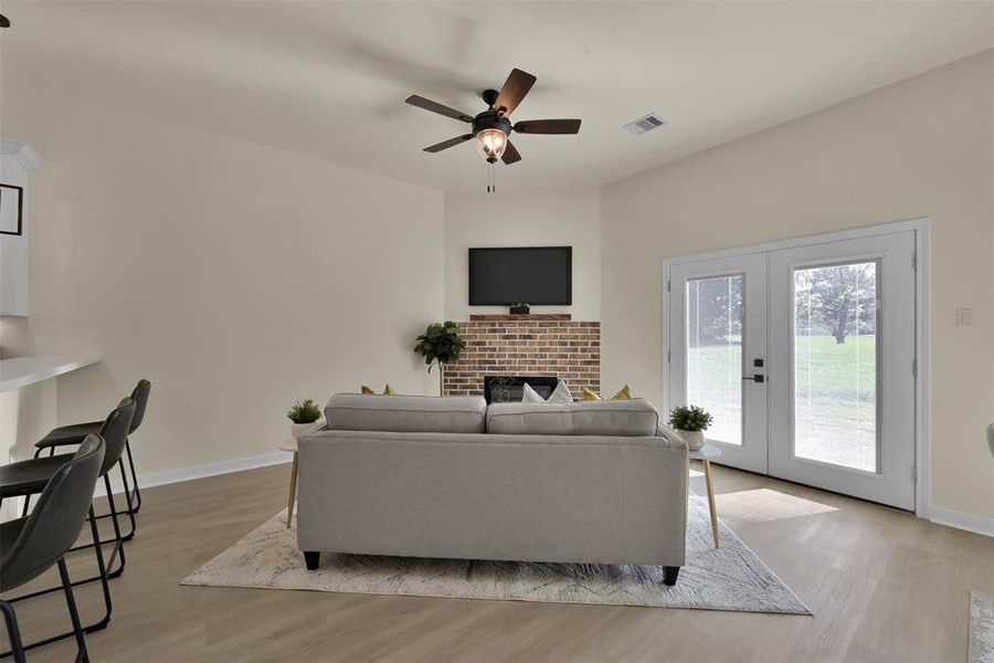 Double doors lead to the backyard area and patio.