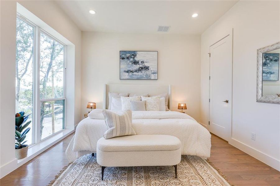 Bedroom with hardwood / wood-style floors