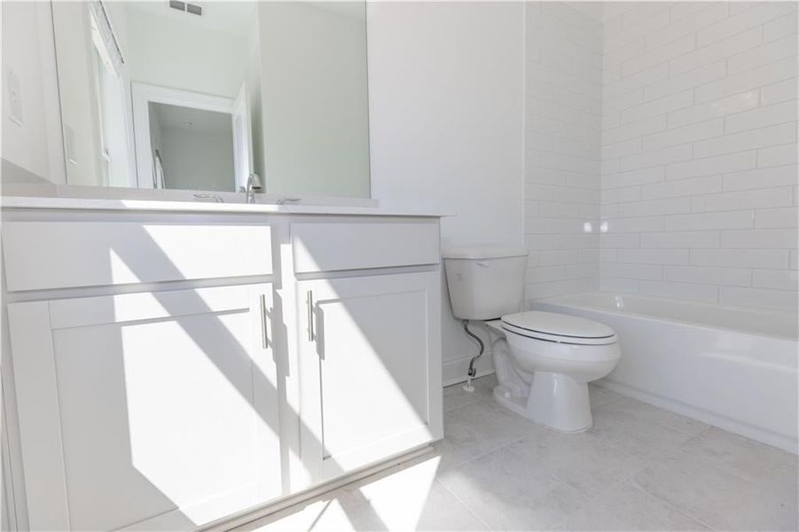 Secondary bathroom on the top level. **Photo not of actual home, for representation purposes only. **