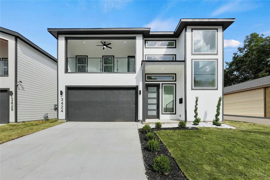 Modern home with a garage and a front yard